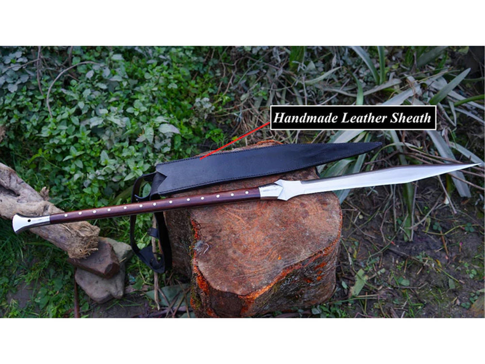 Handmade Viking Spear with 39-inch Carbon Steel Blade and long wooden handle, displayed next to its black handmade leather sheath on a wooden log.